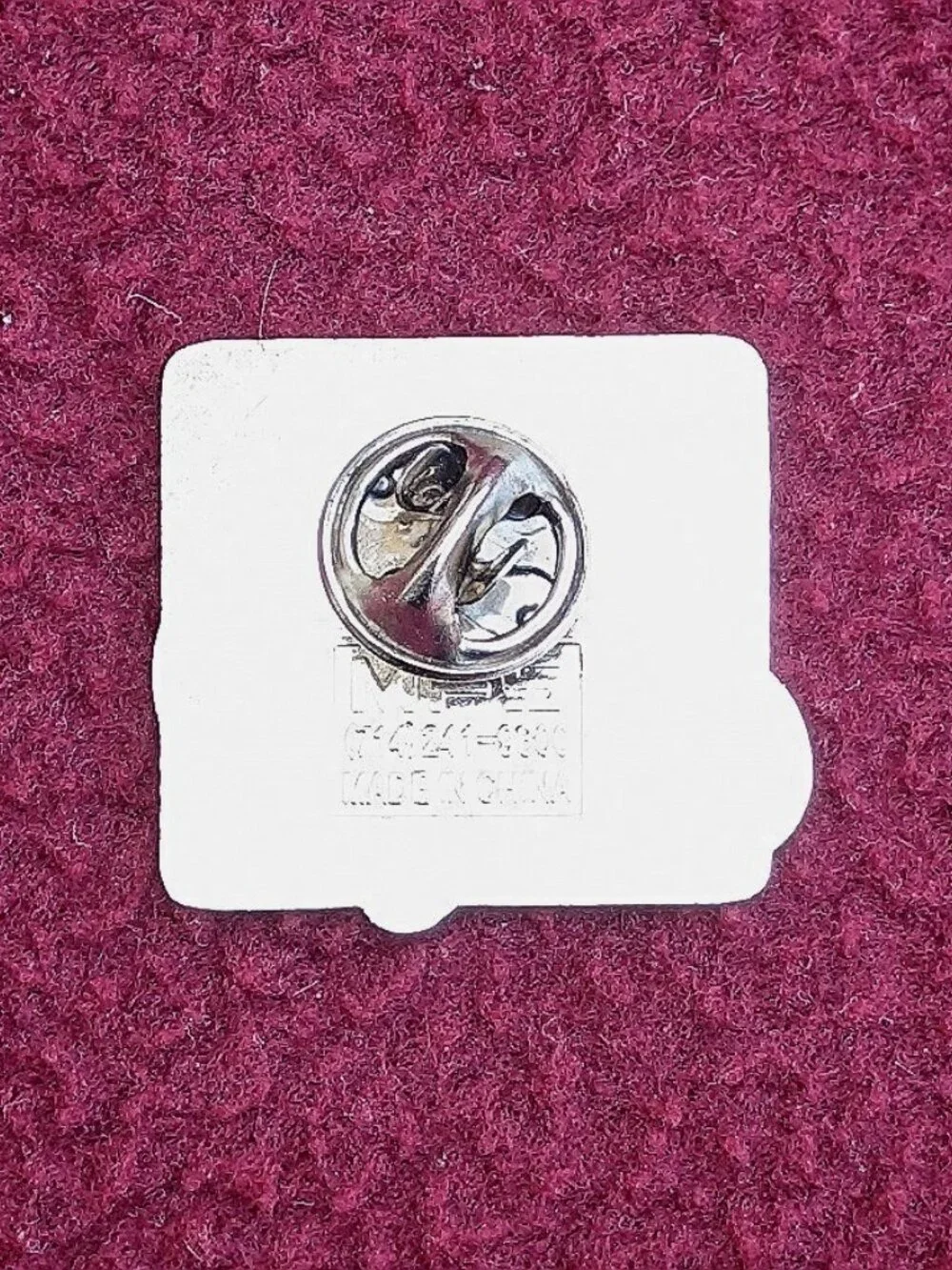 The product is a new 2007 Edelbrock hot rod hat or vest pin.